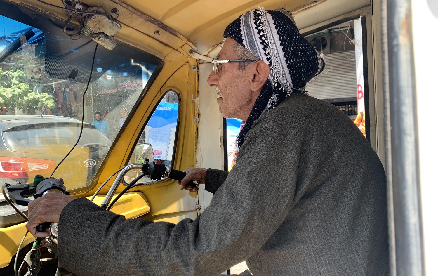 Rasul Ibrahim drives his trusty tuk-tuk through the streets of Koya on July 21, 2020. Photo: Zhelwan Z. Wali / Rudaw